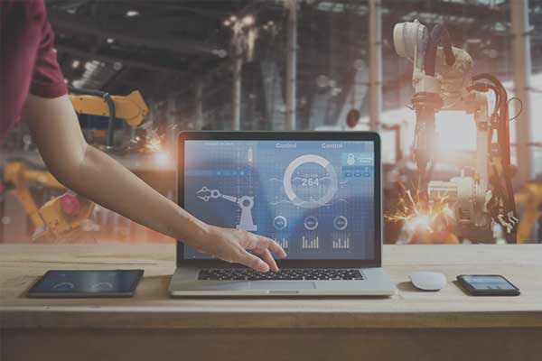 Smart factory with robotic arms being controlled remotely
