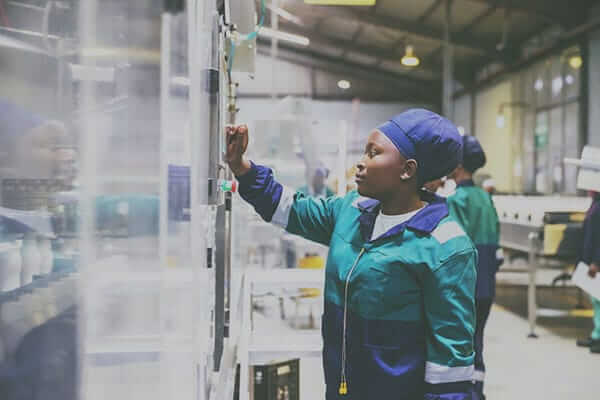 Test engineer managing automated factory