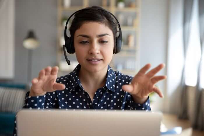 Engineer offering Remote Support Services on her computer