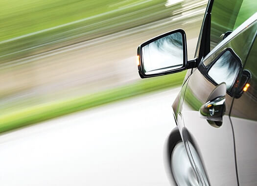 High-tech car speeding in blurred background