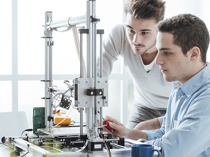 Technicians developing test station